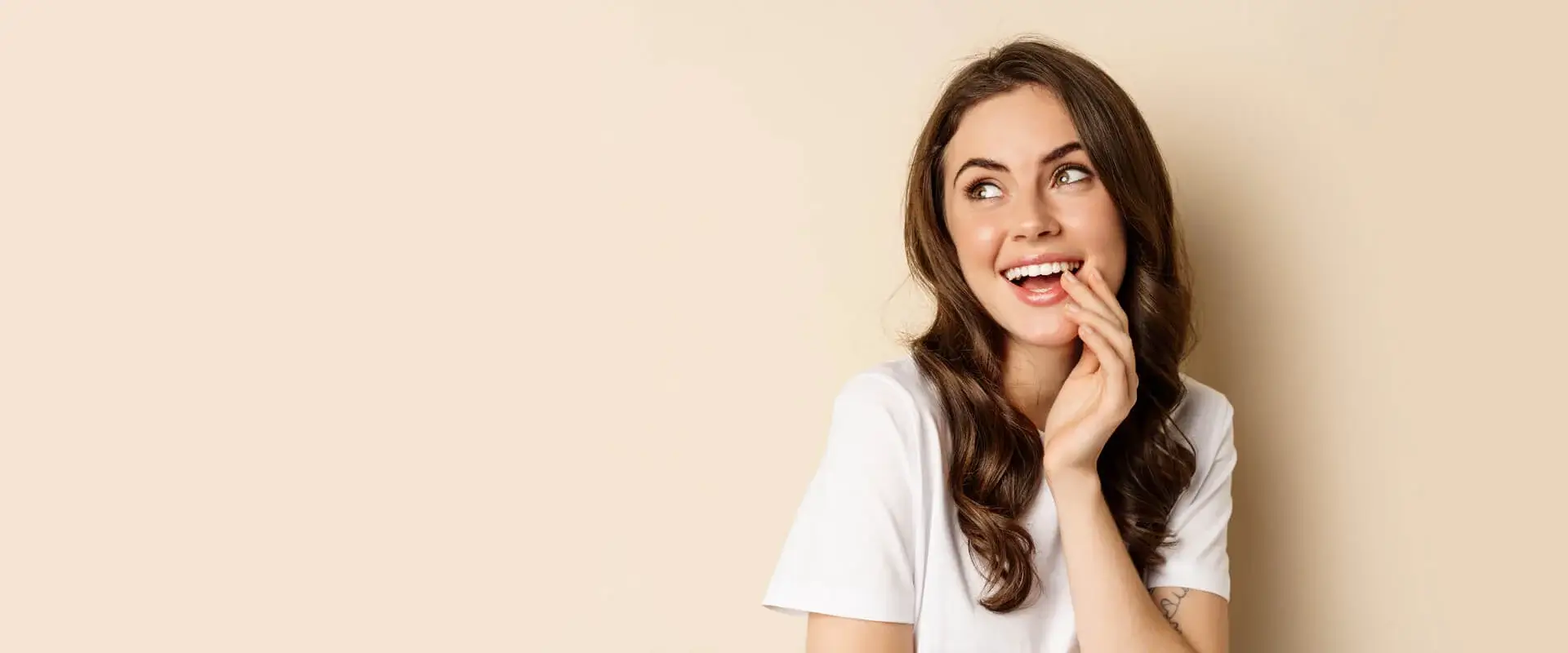 Woman smiling and welcoming at medispa in Glendale
